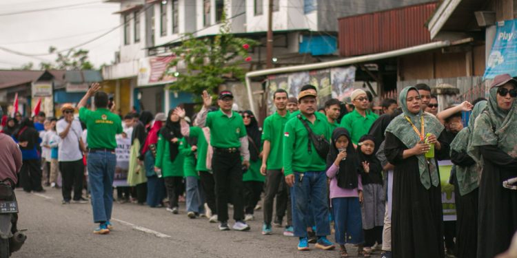 Ribuan warga Kabupaten Mimika, termasuk dari LDII menghadiri Pawai Ta'aruf yang diadakan oleh Panitia Hari Besar Islam (PHBI) Mimika. Foto: LINES.